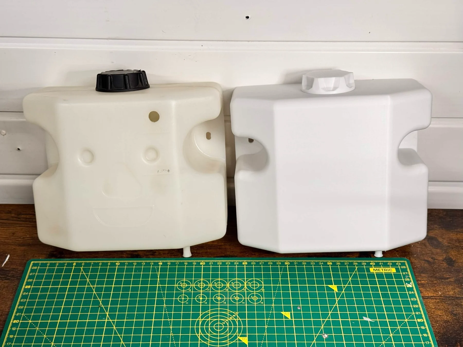 Original water tank and the plastic replacement side by side
